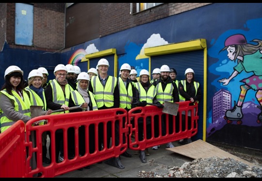 Representatives from Lewisham Council, Youth First, Millwall Community Trust and other project partners celebrate the official ‘groundbreak’ at Riverside Youth Club. 
