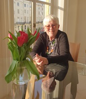 Stella Jeffrey sitting at dining table