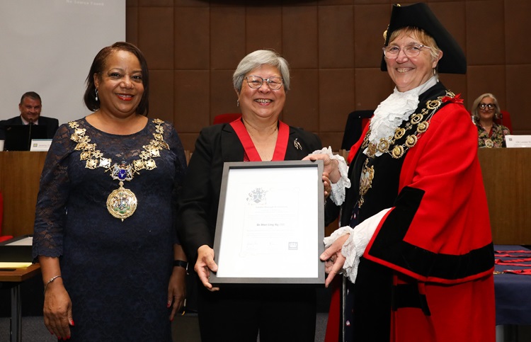 Dr Mee Ling Ng OBE being awarded with title