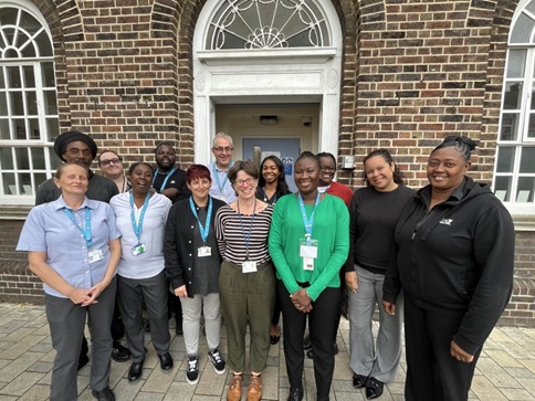 Staff from the Lewisham Youth Justice service outside their premises in Catford