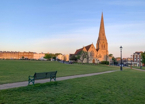 A photo from Blackheath park, a green space with a church in the background