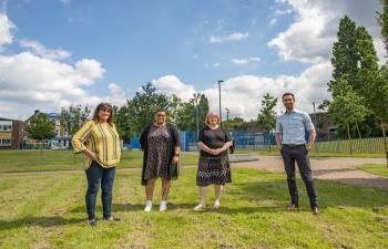 The Mayor and Mayoresses stand in a green space in Deptford