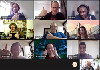 Screenshot of a Zoom call with 10 team members smiling and putting their thumbs up.