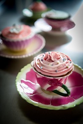 Decorated cupcake in a cup and saucer