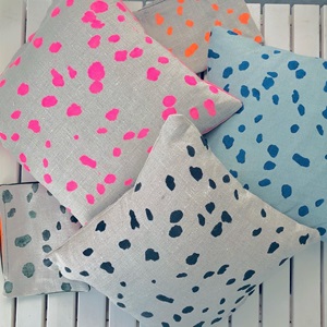 Cushions with upcycled spotted covers