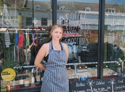 Rachael, owner of Isla Ray in Deptford, standing in front of her cafe/bar 