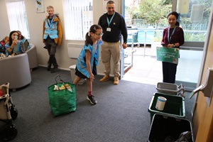 A child plays a recycling game