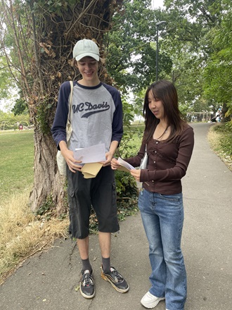 Two Alevel  students reading their results