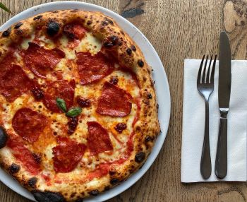 Pepperoni pizza on a white plate