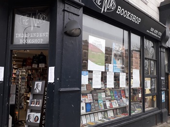 The Word bookshop from the pavement, it has a black facade with white lettering