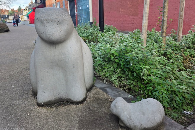 Sculpture of two stone cats