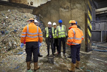 Cllr Patrick Codd and the Council's Waste and Recycling Team stand in front of food waste that has been delivered to the anaerobic digestion plant and hear from staff at the plant about how the process works