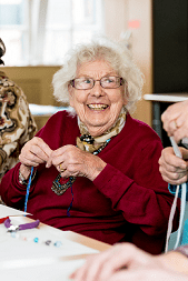 image of an elderly woman doing an activity