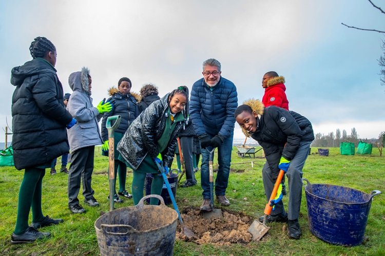 Year 6 class doing some gardening work 