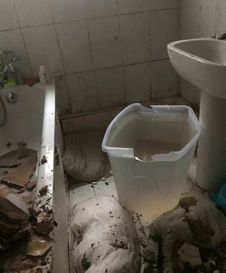 The bathroom after the ceiling had collapsed