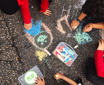 image of children playing on a street